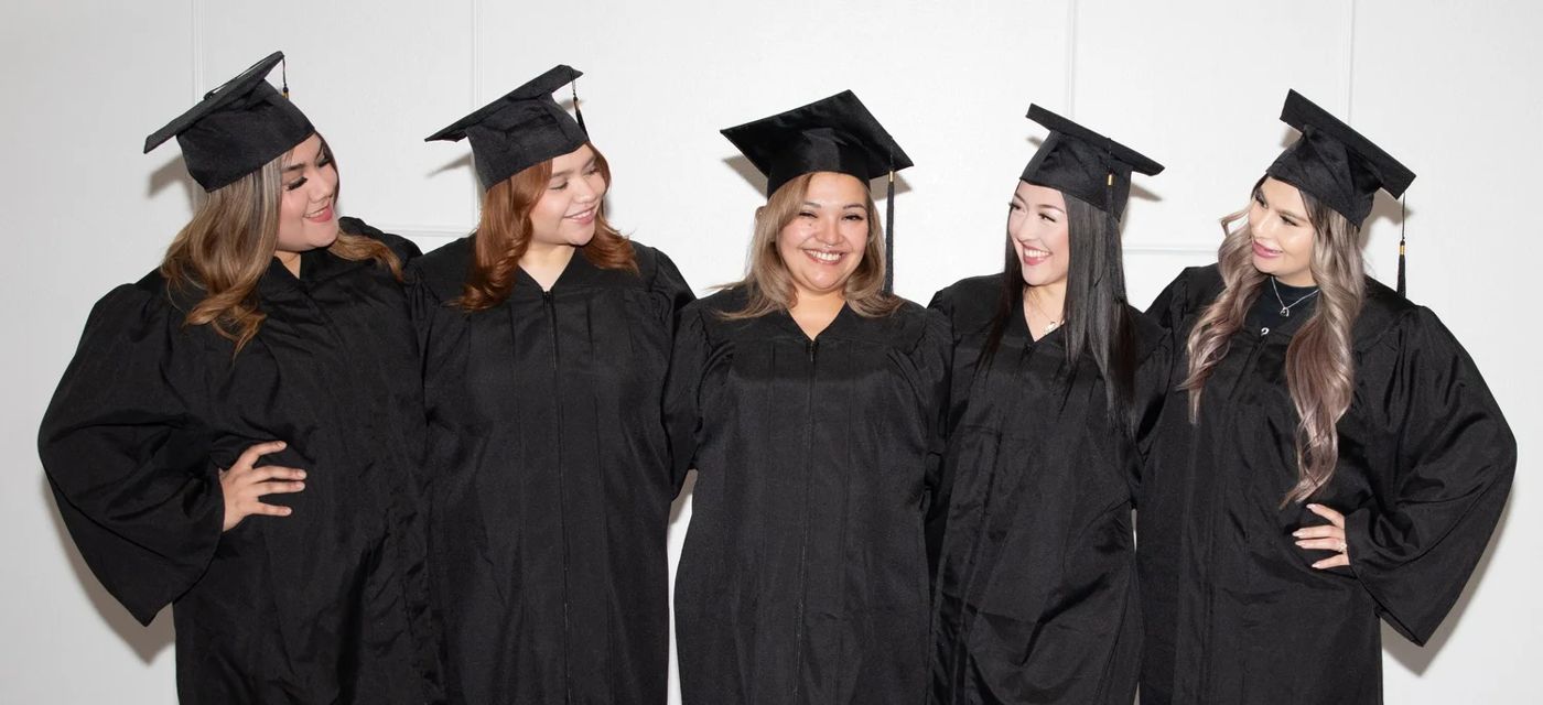 Graduating class in caps and gowns at Nu Generation Esthetics Academy
